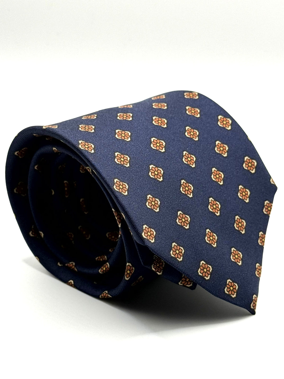 Corbata de seda Clementi azul marino con florecillas terracota y crema