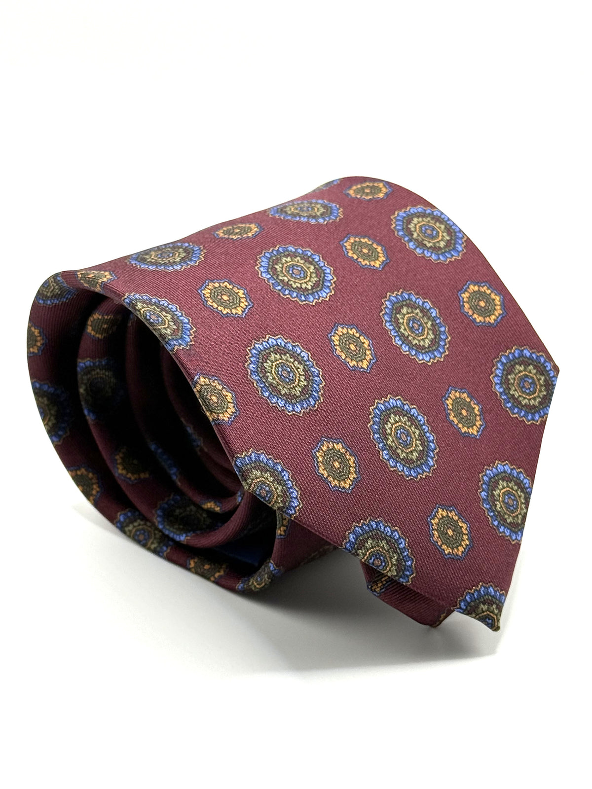 Corbata de seda Monteverdi burdeos con rosetones azules, oliva y naranja
